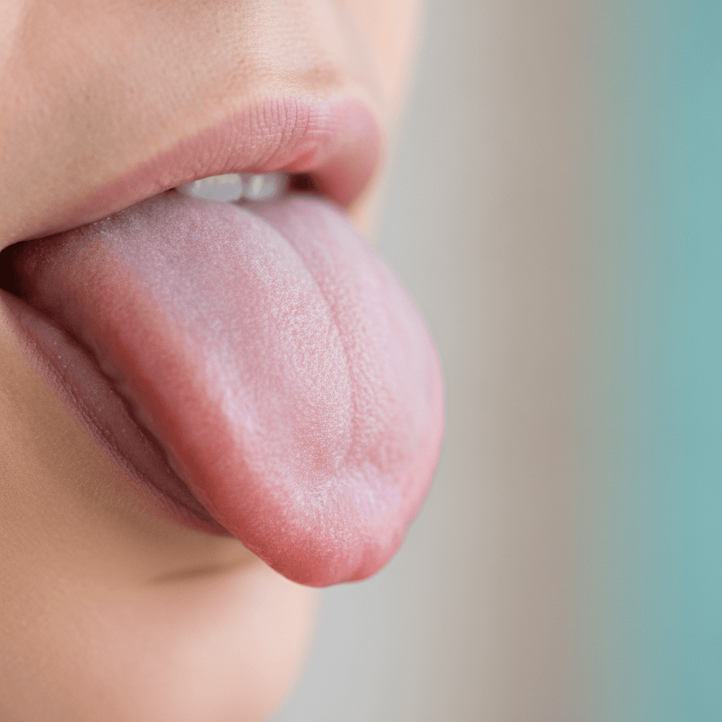 Healthy pink tongue with a thin light coating